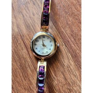 Ladies Goldtone Wristwatch with Purple Decorative Stones